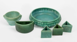 MELROSE WARE green glazed pottery fruit bowl, together with three unusual triangular shaped vases, a crescent shaped vase and a two handled vase, (6 items), stamped "Melrose Ware, Australian" the fruit bowl 28cm diameter