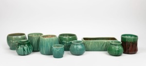 MELROSE WARE group of ten assorted green and brown glazed pottery vases and flower troughs adorned with gum leaves, gumnuts and orchids, the trough 24.5cm wide