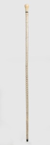 An antique walking stick with carved whale's tooth handle, baleen spacer and ferrule, on a segmented stingray vertebrae shaft, 19th century, 92cm high