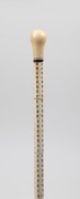 An antique walking stick with carved whale's tooth handle, baleen&nbsp;spacer and ferrule, on a segmented stingray vertebrae shaft, 19th century, 92cm high - 2
