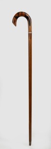 An antique walking stick with sample wood handle including huon pine, blackwood, cedar and some form of exotic ebony, mounted with a rose gold collar with ownership inscription, on a beefwood casuarina shaft with brass ferrule, early 20th century, 88cm hi