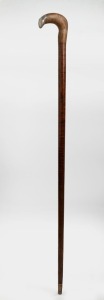 An antique walking stick with Tasmanian musk handle, engraved silver cap, on a fiddleback blackwood shaft with brass ferrule, 19th century, 90cm high