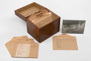 A wooden box containing approximately 30 glass plate negatives, all labeled and most appear to be a record of St. George's Day activities at Warwick, including a football match, a procession, the clubhouse at the bowling green, etc.