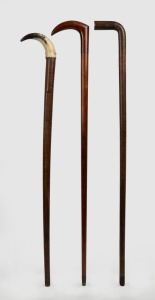 Three fiddleback timber walking sticks, one with horn handle, one with original brass ferrule, 19th and 20th century, the largest 92cm high
