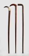 Three fiddleback timber walking sticks, one with horn handle, one with original brass ferrule, 19th and 20th century, the largest 92cm high