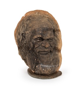 WILLIAM RICKETTS imposing double sided pottery bust displaying a tribal elder on the front and child's face on reverse. Note: Mounted on a slate base. Signed "Wm. Ricketts". 33cm high overall