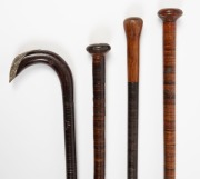 Four assorted antique walking sticks with unusual segmented leather shafts, 19th century, the largest 88cm high - 2