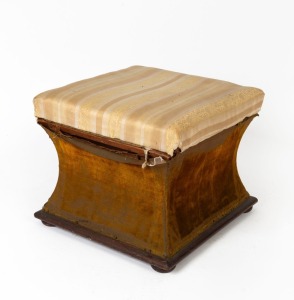 A Colonial Australian cedar sarcophagus shaped storage box footstool, upholstered in what appears to be original gold velvet and later Regency striped fabric, mid 19th century, 45cm high, 52cm deep, 50cm deep