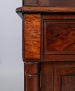 An antique Colonial Australian cedar bookcase with Gothic arched doors, three drawers and full turned columns, New South Wales origin, mid 19th century. Note: This originally was a built-in bookcase, sides have been altered. 259cm high, 146cm wide, 47cm d - 2