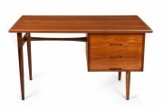 HANS HAYSON&nbsp;mid-century style writing desk with teak veneered top above a bank of three drawers, supported on turned teak legs, 20th century, 70cm high, 123cm wide, 63cm deep