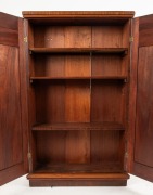 An antique Australian cedar two door stationery cabinet, full length blind doors fitted with arched cedar panels, circa 1870, 135cm high, 85cm wide, 30cm deep - 2