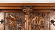 An Arts & Crafts hallstand carved with Australian flora and fauna including possums, koala, cockatoo, gumnuts and leaves, early 20th century, ​​​​​​​206cm high (including cockatoo head piece), 127cm wide, 40cm deep - 2
