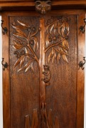 An Arts & Crafts hallstand carved with Australian flora and fauna including possums, koala, cockatoo, gumnuts and leaves, early 20th century, ​​​​​​​206cm high (including cockatoo head piece), 127cm wide, 40cm deep - 3