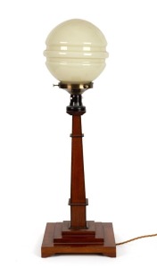 An Australian Art Deco table lamp made from silky oak, blackwood and other native timbers, with glass shade, circa 1930, 82cm high