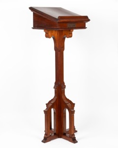 A Gothic revival Tasmanian blackwood lectern with grape and leaf carved panel, mid 20th century, bearing brass dedication plaque "In loving remembrance of my husband, Norman McKinnon who fell asleep in Jesus on June 16th, 1943", 126cm high, 41cm wide, 41cm deep