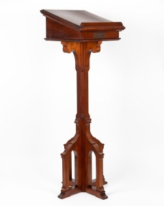 A Gothic revival Tasmanian blackwood lectern with grape and leaf carved panel, mid 20th century, bearing brass dedication plaque "In loving remembrance of my husband, Norman McKinnon who fell asleep in Jesus on June 16th, 1943", 126cm high, 41cm wide, 41c