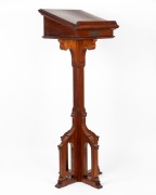 A Gothic revival Tasmanian blackwood lectern with grape and leaf carved panel,&nbsp;mid 20th century, bearing brass dedication plaque "In loving remembrance of my husband, Norman McKinnon who fell asleep in Jesus on June 16th, 1943", 126cm high, 41cm wide, 41c