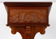 A Gothic revival Tasmanian blackwood lectern with grape and leaf carved panel,&nbsp;mid 20th century, bearing brass dedication plaque "In loving remembrance of my husband, Norman McKinnon who fell asleep in Jesus on June 16th, 1943", 126cm high, 41cm wide, 41c - 4