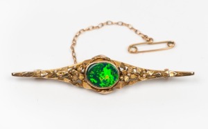 A vintage 9ct yellow gold and opal doublet brooch, early 20th century, stamped "9ct", 5.8cm wide, 4.7 grams