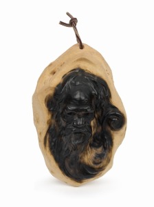 WILLIAM RICKETTS (1888 - 1993) Small ceramic wall hanging featuring the face of an Aboriginal elder. Impressed "WM. Ricketts" on reverse. 14cm high