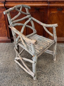 An Australian folk art stick armchair with remains of original painted finish, 19th/20th century, 99cm high, 57cm across the arms