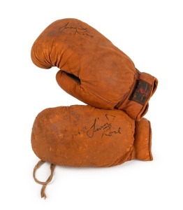 LIONEL ROSE signatures on pair of vintage Australian-made Denzil Don boxing gloves. PROVENANCE: signed by Rose at his Mentone property as a gift to the vendor.