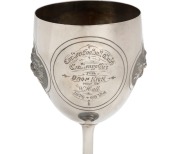 THE CARLTON FOOTBALL CLUB CHALLENGE CUP - 1876 - WON BY GEELONG PLAYER, WILLIAM "TRUSTY" HALL OF THE GEELONG FOOTBALL CLUB A sterling silver cup depicting a footballer about to kick for goal and engraved "Carlton Football Club Challenge Cup for DROP KICK - 3