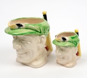 DON BRADMAN&nbsp;graduated pair of Japanese porcelain character jugs, by Marutomo, black factory mark to base, 15cm and 10cm high