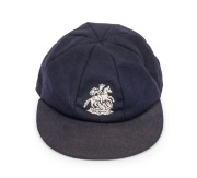 TIM ROBINSON (England): Robinson's England "Touring" Test Team Cap, navy blue wool with embroidered St. George and the Dragon, endorsed in pen "T. Robinson" on the white label in the crown of the cap. From Robinson's last year in the Test Team, 1989.
