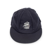 DEVON MALCOLM (England): Malcolm's England "Touring" Test Team Cap, navy blue wool with embroidered St. George and the Dragon, endorsed in pen "D.M." on the Albion label in the crown of the cap. From Malcolm's last tour of Australia in 1994-95.