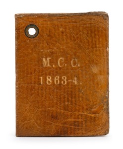 Melbourne Cricket Club: 1863-64 Member's Season Ticket, brown leather covers with gilt 'M.C.C. 1863-4.' on front & back; signed internally by the Treasurer, J. Henderson. Extremely scarce.