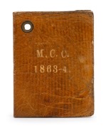 Melbourne Cricket Club: 1863-64 Member's Season Ticket, brown leather covers with gilt 'M.C.C. 1863-4.' on front & back; signed internally by the Treasurer, J. Henderson. Extremely scarce.
