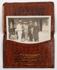 A Smythson of Bond Street leather wallet, with multiple internal compartments and gilt lettering: "With Congratulations and Best Wishes to MR. E.H. BROMLEY from W. Harrison. Australia v England 1934." The wallet contains are original photo postcard of Bromley and other team members. Provenance: The Estate of Ernie Bromley.