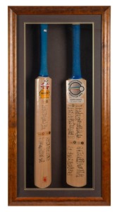Two souvenir bats framed together, the first being No. 1716 of 2000 created for the 1985 World Championship of Cricket with signatures from all seven teams, the second being No. 279 of 1800 created for the Benson & Hedges World Cup 1992 with signatures from all nine teams; Custom-made case enables viewing of both blades of the bats, All signatures appear to be printed, Overall 100 x 50cm
