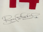 BOB SKILTON Original signature on reverse of No. 14 South Melbourne Football Club Guernsey; Framed & glazed; Overall 96 x 63cm Bob Skilton is one of only four Australian Rules footballers to have been awarded the Brownlow Medal on three occasions, 1959, - 2