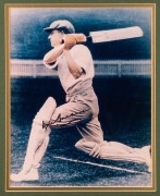 Don Bradman original signature on reproduction photograph. framed & glazed. Together with three other photographs and a plaque describing Bradman's career. With COA. Overall 76 x 106cm. - 2