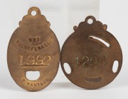 MELBOURNE CRICKET CLUB, membership fobs for 1930-31 and 1933-34, both made by C. Bentley. (2). - 4