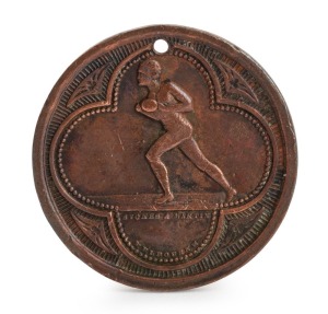 1886 Football Medal, showing on front a footballer running with ball in hand and "Stokes and Martin, Melbourne"; verso with "Victoria 1886" with leaves between the word and the date with a blank centre; holed at top. Believed to be associated with an intercolonial football match. Only the fourth example known to us, one example being held in the Museum Victoria Collection, another example having been sold by us in April 2015 for $1159 inc BP.