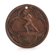 1886 Football Medal, showing on front a footballer running with ball in hand and "Stokes and Martin, Melbourne"; verso with "Victoria 1886" with leaves between the word and the date with a blank centre; holed at top. Believed to be associated with an inte