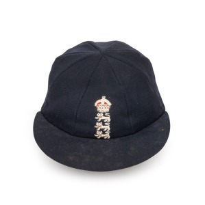 KEN BARRINGTON'S ENGLAND TEST TEAM CAP with embroidered crown and three lions crest and his name in ink to the Simpson's label inside the crown. Generally in very good condition.Kenneth Frank Barrington (1930 - 1981) was a right-handed batsman and occasional leg-break bowler for England and Surrey. His first class career spanned between 1953 - 1968. He made 76 first class centuries (20 in Test Matches). He played 82 Test Matches for England.Provenance: Graham Budd Auctions, Lot 787, May 2