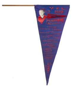 1957 MELBOURNE Grand Final souvenir pennant listing all the team members and showing their positions on the field, with club captain, John Beckwith depicted at top left. 42cm. A particularly rare example we have not previously seen.