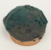 BILL JOHNSTON'S AUSTRALIAN 1947-48 BAGGY GREEN TEST TEAM CAP, green wool with embroidered Australian cost-of-arms and the dates "1947-48"embroidered to the front panel; "Farmers Sydney" label to the inside crown. Poor condition. Bill Johnston played in 4 - 4