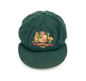 AN AUSTRALIAN TEST TEAM BAGGY GREEN dated "1956" (player unknown), green wool with the Australian coat-of-arms and the year "1956" embroidered to the front panel. Fairly good condition but with some holes/wear to the left and rear of the cap. Provenance: Bonhams UK Auction, 27 Feb. 2008, Lot 17.