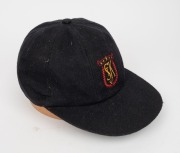 SHANE WARNE'S ST. KILDA CAP, black, with the embroidered "ST K CC" logo embroidered to the front panel. Signed by Warne to the back of the panel. Very good condition. Warne had joined the St. Kilda Cricket Club for the 1985-86 season when he was 16 years - 3