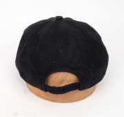 SHANE WARNE'S ST. KILDA CAP, black, with the embroidered "ST K CC" logo embroidered to the front panel. Signed by Warne to the back of the panel. Very good condition. Warne had joined the St. Kilda Cricket Club for the 1985-86 season when he was 16 years - 4