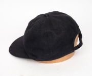 SHANE WARNE'S ST. KILDA CAP, black, with the embroidered "ST K CC" logo embroidered to the front panel. Signed by Warne to the back of the panel. Very good condition. Warne had joined the St. Kilda Cricket Club for the 1985-86 season when he was 16 years - 5