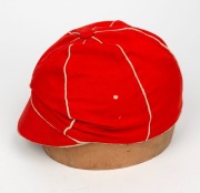 A TASMANIAN COLONIAL CRICKET CAP from the late 19th Century, red with white piping, a button-down peak, and with an illegible signature under the brim. Although worn in places, in remarkably good condition for one of the oldest surviving Australian cricke - 4