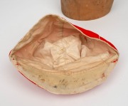 A TASMANIAN COLONIAL CRICKET CAP from the late 19th Century, red with white piping, a button-down peak, and with an illegible signature under the brim. Although worn in places, in remarkably good condition for one of the oldest surviving Australian cricke - 5