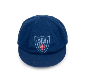 GLENN McGRATH'S NEW SOUTH WALES CRICKET TEAM CAP, circa 2000, blue wool, with embroidered NSWCA logo to front panel, signed in ink on the Albion label by McGrath. Fine condition. Glenn McGrath appeared in 124 Test Matches for Australia between 1993 and 2007. He took 563 Test Match wickets, taking 5 in an innings 29 times and 10 in a match 3 times.