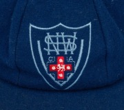 GLENN McGRATH'S NEW SOUTH WALES CRICKET TEAM CAP, circa 2000, blue wool, with embroidered NSWCA logo to front panel, signed in ink on the Albion label by McGrath. Fine condition. Glenn McGrath appeared in 124 Test Matches for Australia between 1993 and 2 - 3